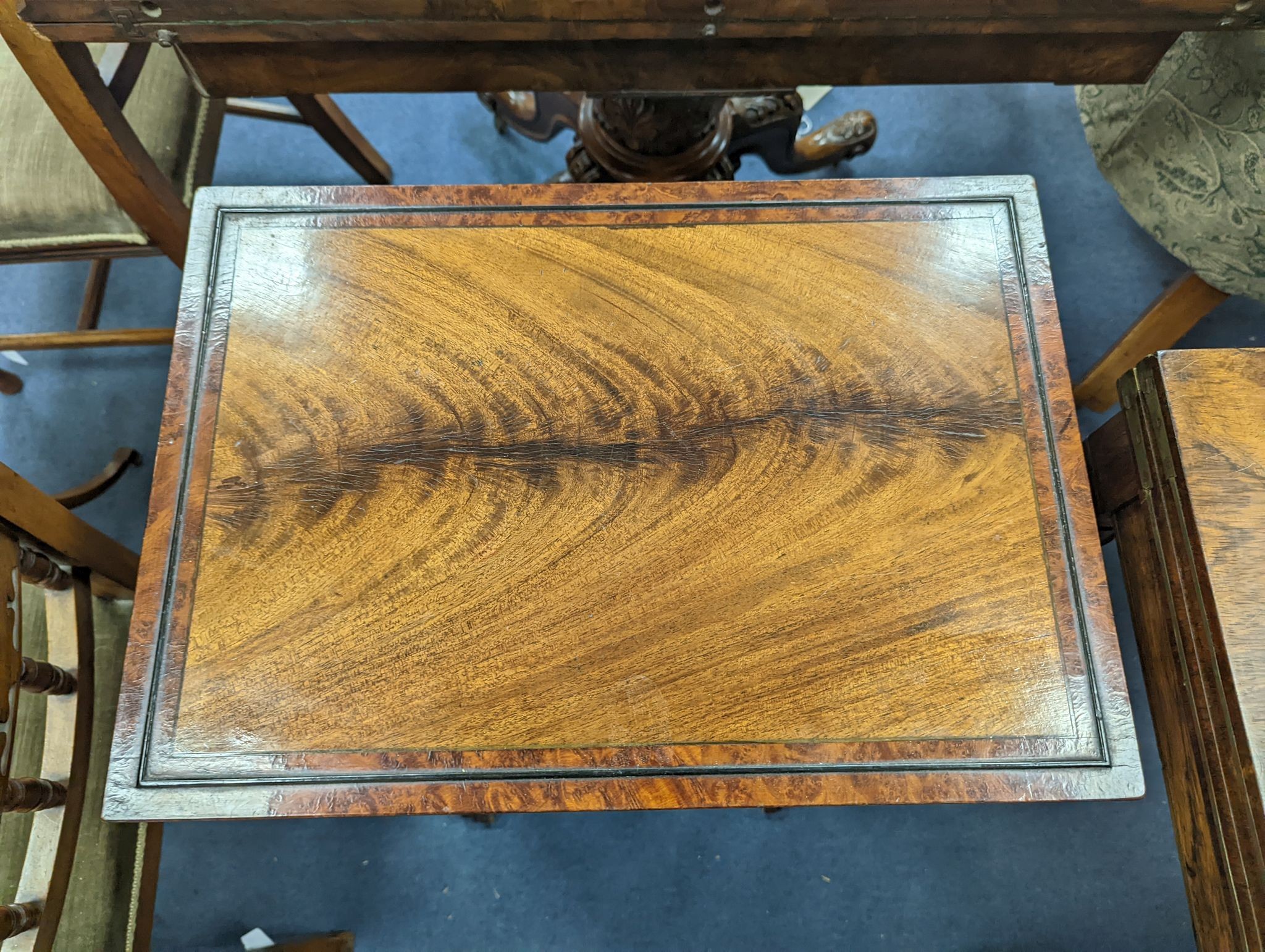 A nest of three Amboyna banded rectangular mahogany tea tables, width 48cm, depth 34cm, height 74cm